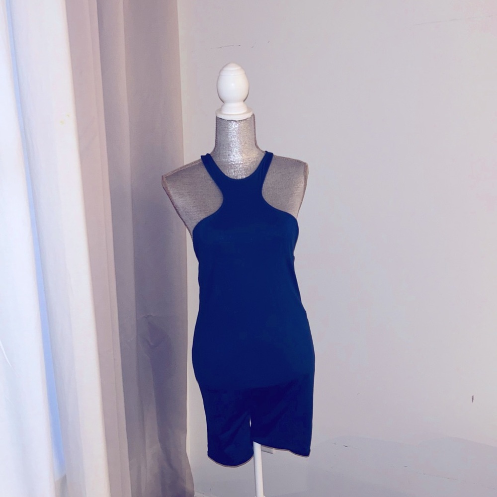 Blue sleeveless romper with sporty detail.